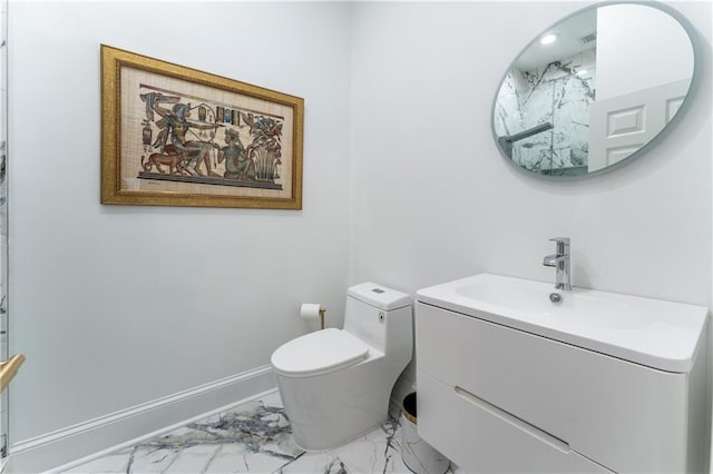 full bath featuring vanity, toilet, baseboards, and marble finish floor