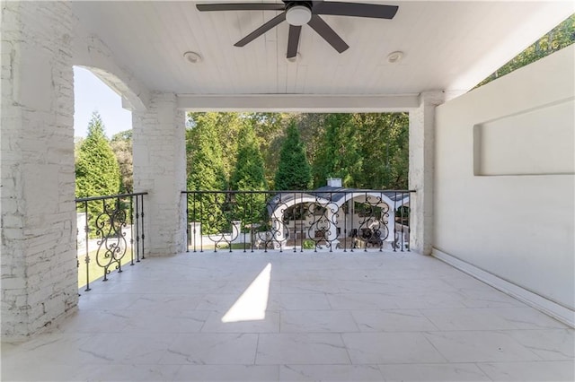 view of patio featuring a ceiling fan