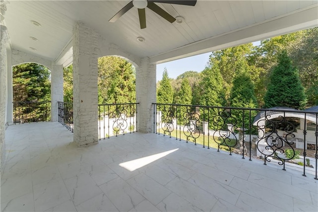 view of patio / terrace featuring a balcony and a ceiling fan