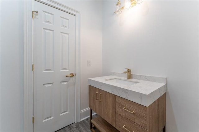 bathroom featuring wood finished floors and vanity