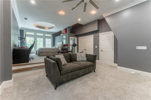 carpeted living room featuring a ceiling fan, crown molding, visible vents, and baseboards