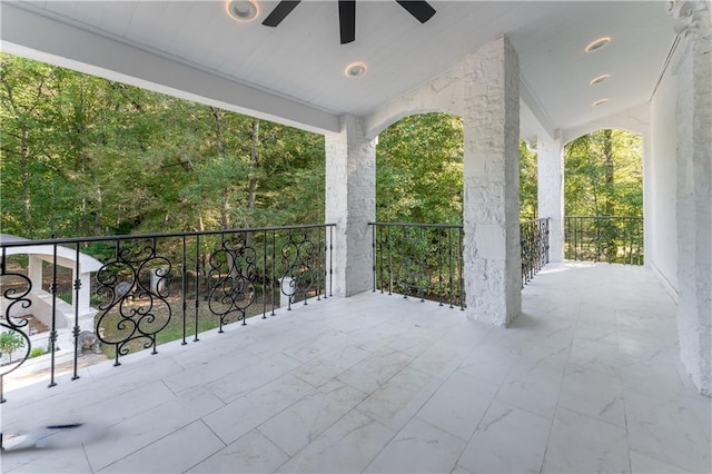 view of patio featuring ceiling fan