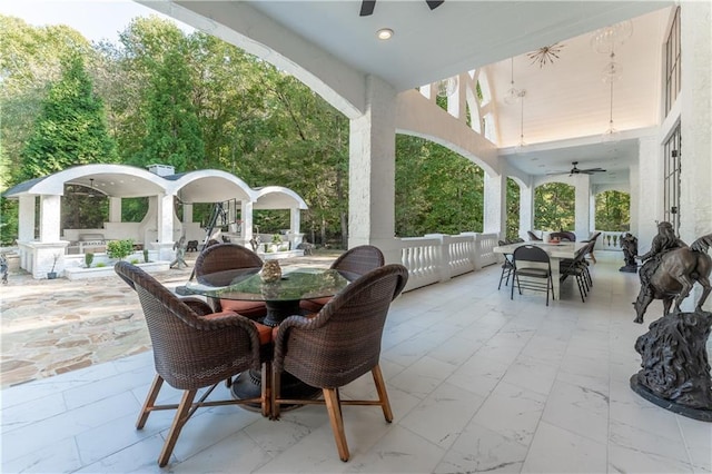 view of patio / terrace with outdoor dining space and ceiling fan