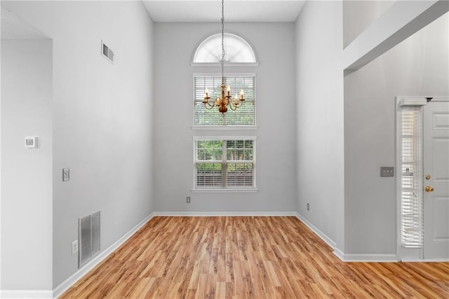 3549 Daventry Ln NW, Kennesaw, GA 30144 - foyer entrance featuring a chandelier and light wood finished floors