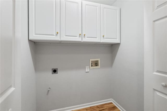 3549 Daventry Ln NW, Kennesaw, GA 30144 - washroom with electric dryer hookup, washer hookup, cabinet space, and wood finished floors
