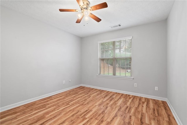 3549 Daventry Ln NW, Kennesaw, GA 30144 - spare room with light wood-type flooring, a textured ceiling, and a ceiling fan