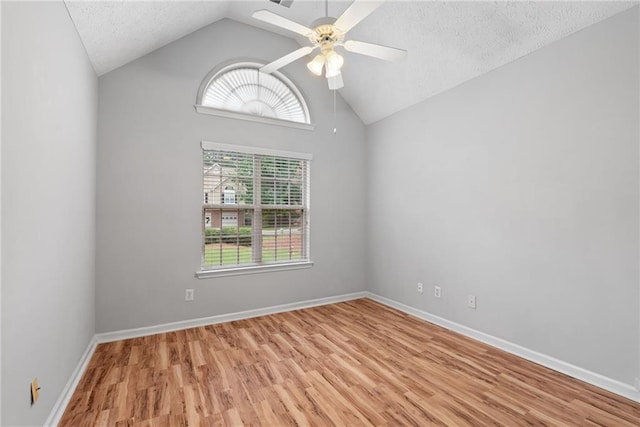 3549 Daventry Ln NW, Kennesaw, GA 30144 - spare room with vaulted ceiling, light wood-style flooring, ceiling fan, and a textured ceiling