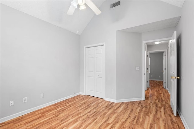 3549 Daventry Ln NW, Kennesaw, GA 30144 - unfurnished bedroom featuring light wood finished floors, a closet, ceiling fan, and high vaulted ceiling