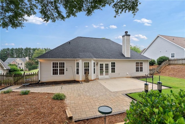 3549 Daventry Ln NW, Kennesaw, GA 30144 - rear view of house featuring french doors, a patio area, and a chimney