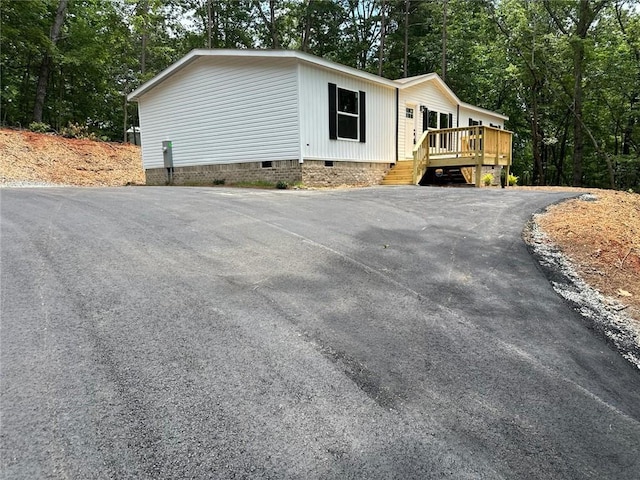 551 Fern Valley Trl NE, Clarkesville, GA 30523 - view of front of property featuring crawl space, a deck, and driveway