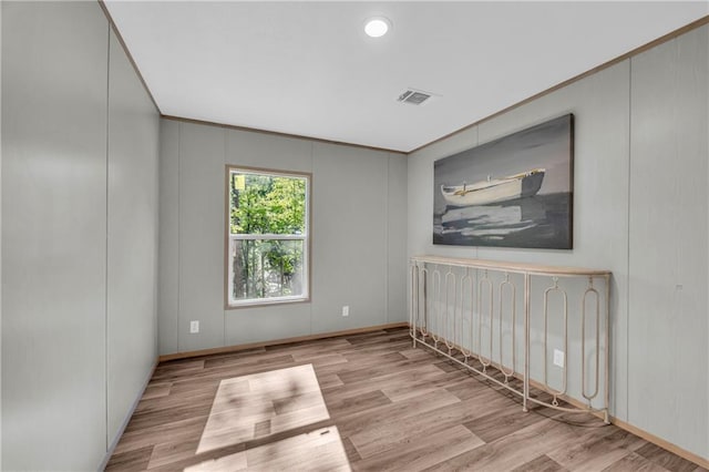 551 Fern Valley Trl NE, Clarkesville, GA 30523 - spare room with wood finished floors and a decorative wall