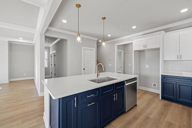 kitchen featuring dishwasher, blue cabinets, white cabinetry, and a sink