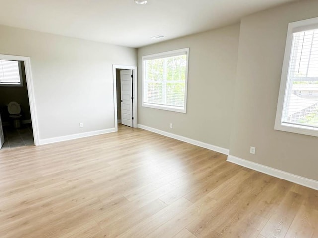 5816 Gainesville St, Flowery Branch, GA 30542 - unfurnished bedroom featuring baseboards and light wood-style floors