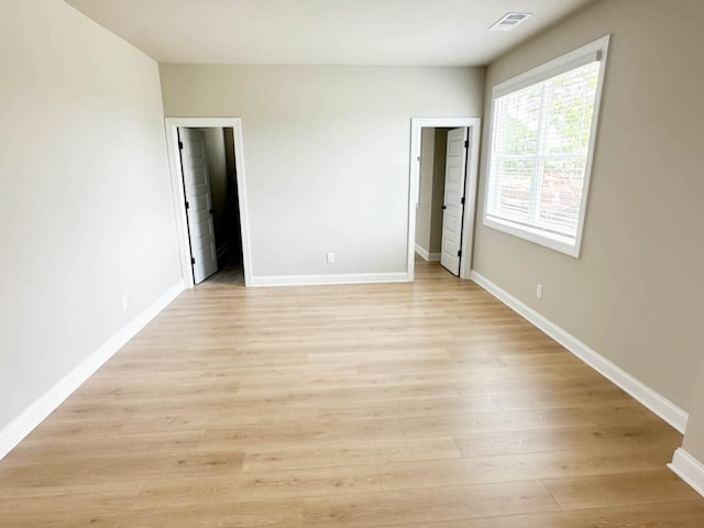 5816 Gainesville St, Flowery Branch, GA 30542 - unfurnished bedroom with light wood-type flooring and baseboards
