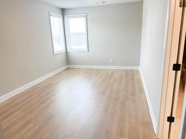5816 Gainesville St, Flowery Branch, GA 30542 - empty room featuring light wood-style floors and baseboards