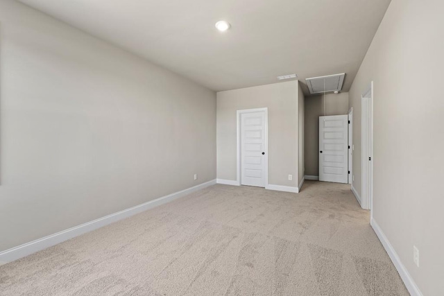 unfurnished bedroom featuring visible vents, recessed lighting, carpet floors, baseboards, and attic access