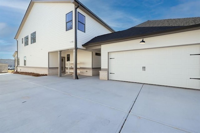 5816 Gainesville St, Flowery Branch, GA 30542 - view of front of house featuring driveway, a garage, and brick siding