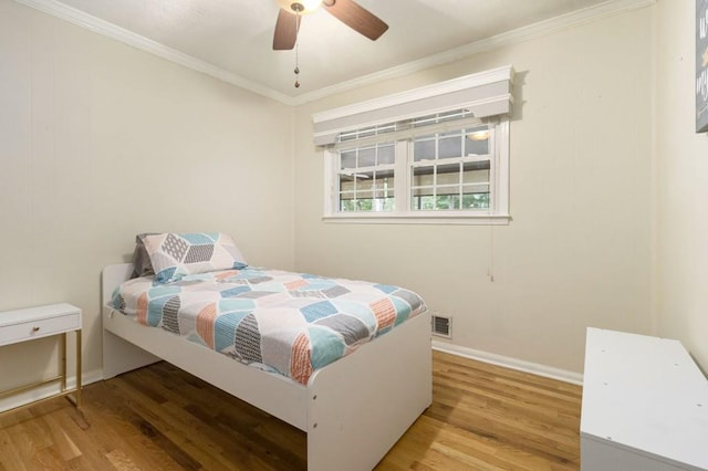 1134 Roscoe Rd, Newnan, GA 30263 - bedroom with wood finished floors, crown molding, and ceiling fan