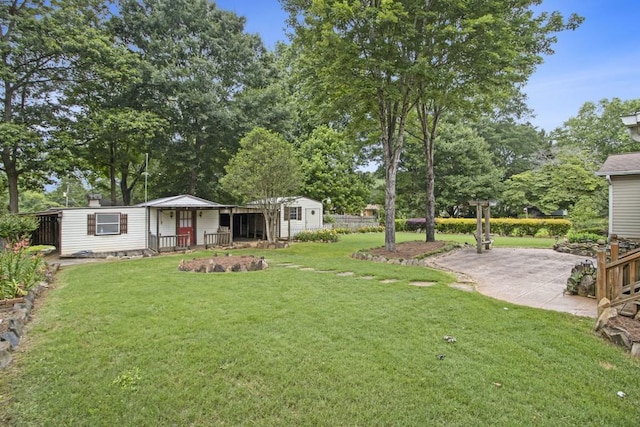 1134 Roscoe Rd, Newnan, GA 30263 - view of green lawn featuring a patio area