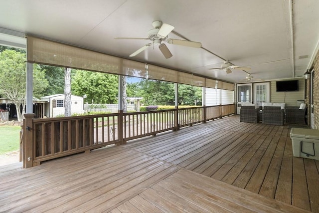 1134 Roscoe Rd, Newnan, GA 30263 - wooden terrace featuring a ceiling fan, an outdoor living space, and a storage shed