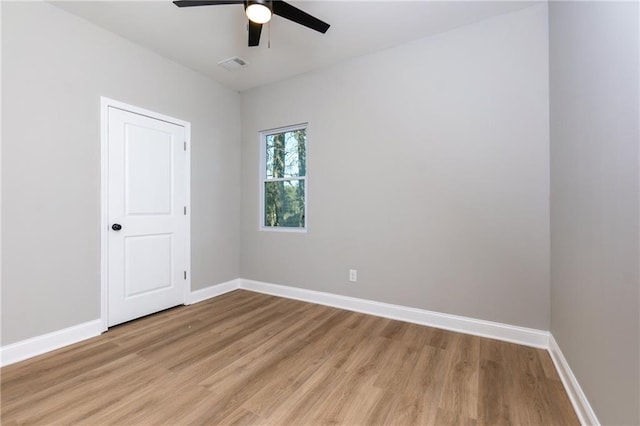 unfurnished room with ceiling fan and light wood-type flooring