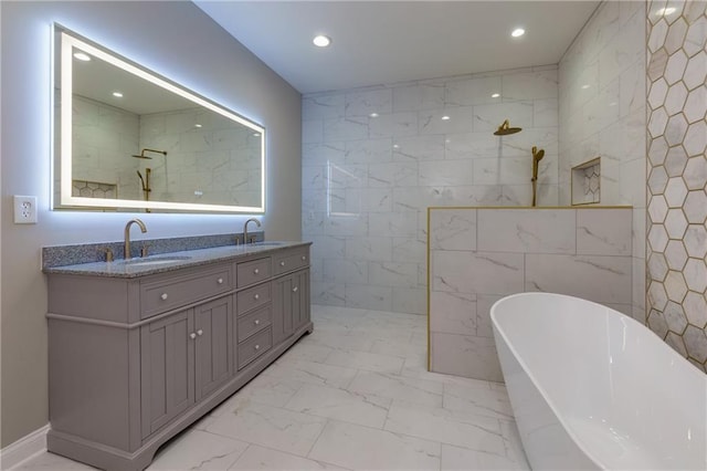 bathroom with vanity, separate shower and tub, and tile walls