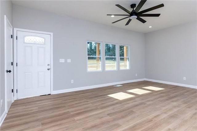 entrance foyer with ceiling fan and light wood-type flooring