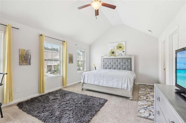 carpeted bedroom with ceiling fan and lofted ceiling