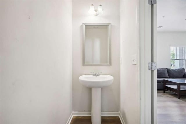 bathroom featuring sink and hardwood / wood-style floors