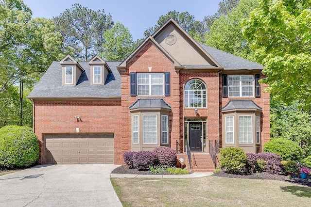 view of front of home with brick siding, driveway, roof with shingles, and a garage