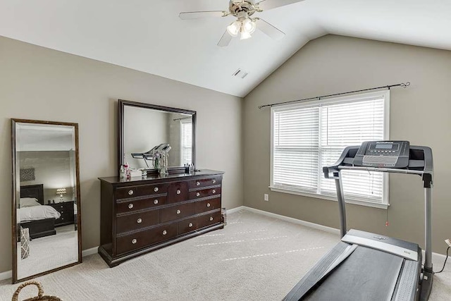 exercise area featuring vaulted ceiling, visible vents, a ceiling fan, light carpet, and baseboards