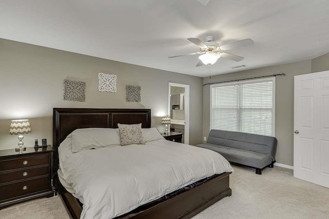 bedroom featuring light carpet, baseboards, visible vents, ceiling fan, and connected bathroom