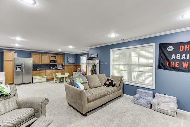 living room featuring baseboards, light carpet, ornamental molding, and recessed lighting