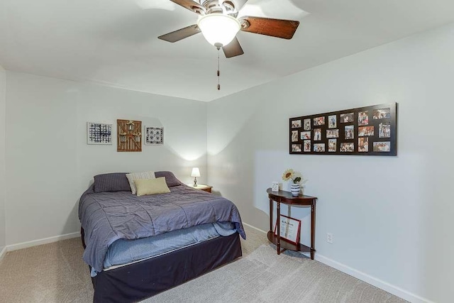 bedroom with baseboards, carpet floors, and ceiling fan