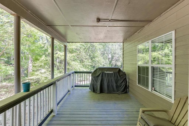 wooden deck featuring area for grilling