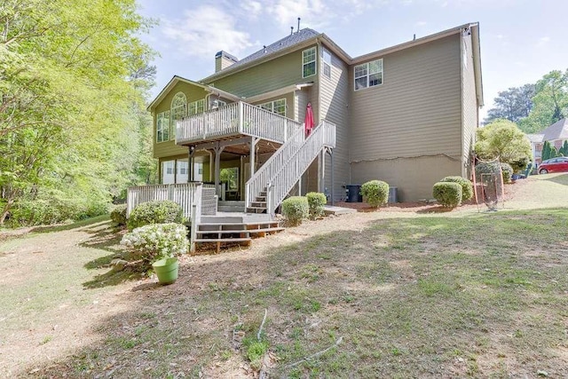 back of property featuring a wooden deck, central AC, a chimney, and stairway