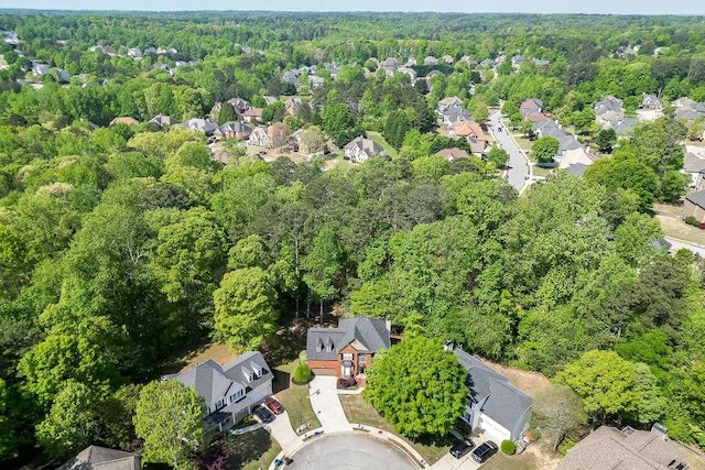birds eye view of property featuring a residential view and a forest view