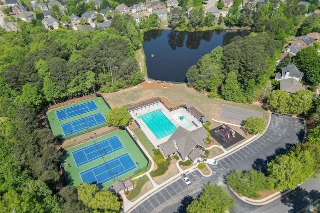 birds eye view of property with a water view