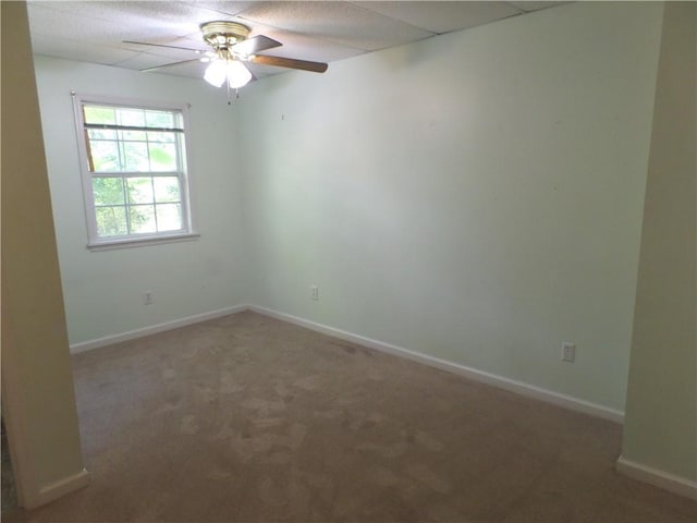 carpeted empty room with ceiling fan