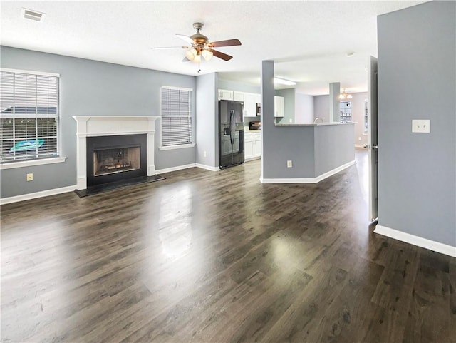 453 Inkberry Dr, Atlanta, GA 30349 - unfurnished living room with ceiling fan and dark hardwood / wood-style flooring