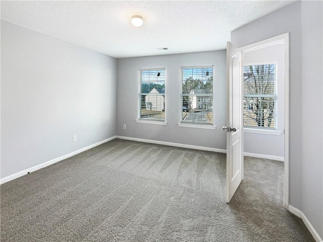 453 Inkberry Dr, Atlanta, GA 30349 - unfurnished room featuring carpet floors and a textured ceiling