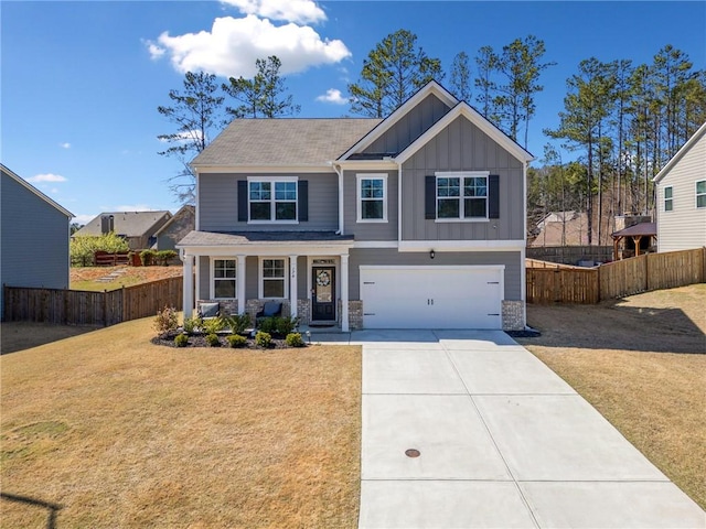 174 Sienna Blf, Dallas, GA 30132 - craftsman house with fence, board and batten siding, driveway, a front lawn, and a garage
