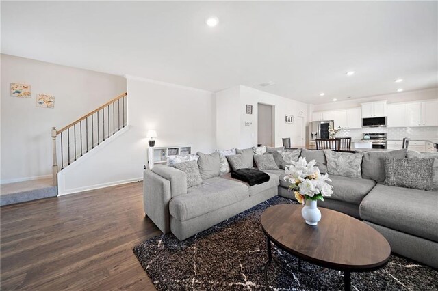 174 Sienna Blf, Dallas, GA 30132 - living area with baseboards, recessed lighting, stairway, and dark wood-type flooring