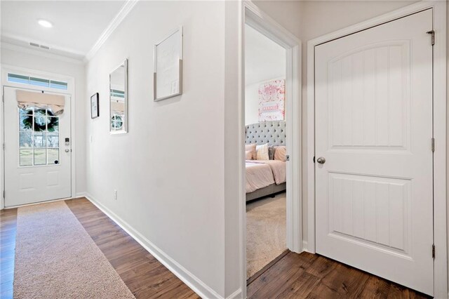 174 Sienna Blf, Dallas, GA 30132 - corridor featuring baseboards, visible vents, crown molding, and dark wood-style floors