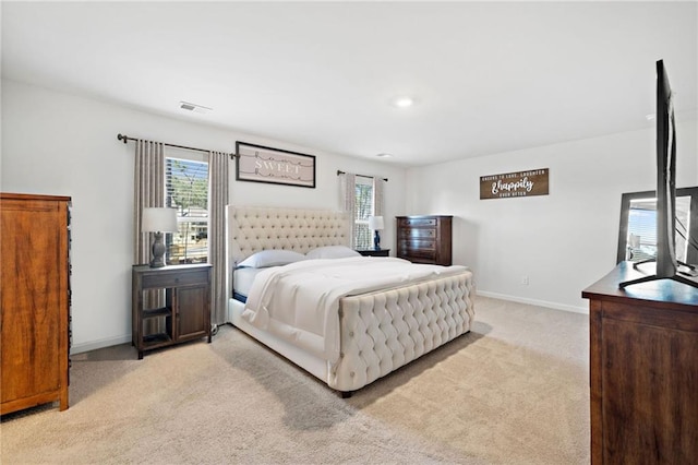 174 Sienna Blf, Dallas, GA 30132 - bedroom featuring light colored carpet, visible vents, multiple windows, and baseboards
