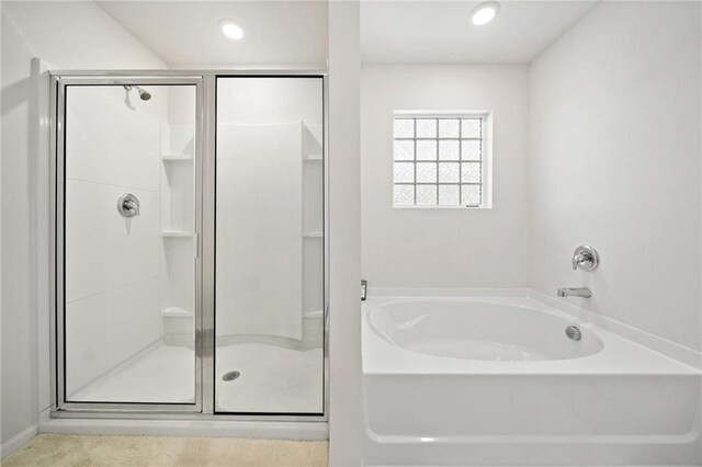 174 Sienna Blf, Dallas, GA 30132 - bathroom featuring a garden tub, a stall shower, and recessed lighting