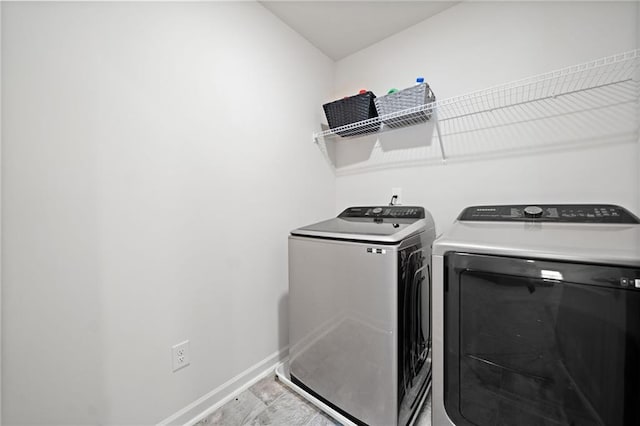 174 Sienna Blf, Dallas, GA 30132 - clothes washing area featuring independent washer and dryer, light wood-style floors, baseboards, and laundry area