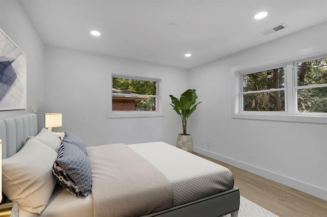 1770 Austin Dr, Decatur, GA 30032 - bedroom with multiple windows, light wood-type flooring, and recessed lighting