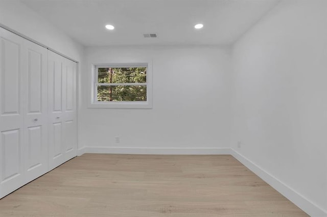 1770 Austin Dr, Decatur, GA 30032 - unfurnished bedroom featuring light wood finished floors, recessed lighting, and a closet