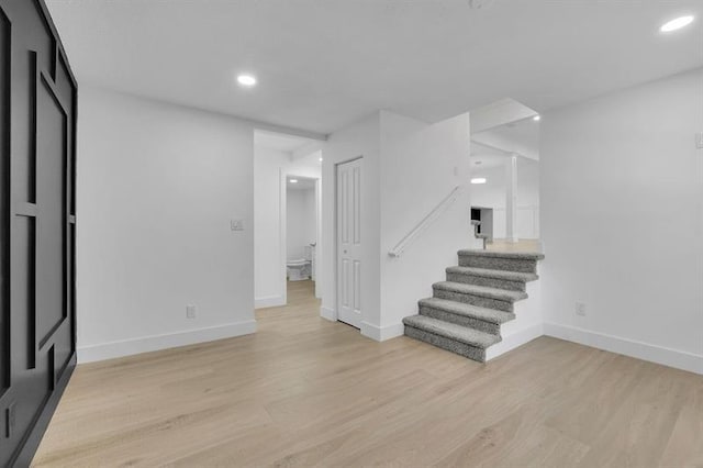 1770 Austin Dr, Decatur, GA 30032 - below grade area with stairs, light wood finished floors, and recessed lighting